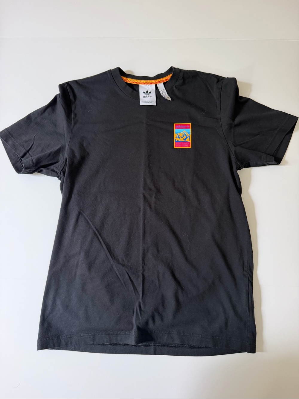 adidas Black Short-Sleeve Men's Tee with Multicolor Chest Patch